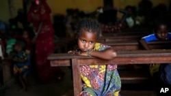  A Muslim child sits inside the St. Pierre church where she and hundreds of other Muslims are seeking refuge in Boali, Central African Republic, some 80kms (50 miles) north-west of Bangui, Thursday, Jan. 23, 2014. Clashes erupted between Anti-Balaka Chri