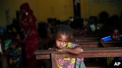  A Muslim child sits inside the St. Pierre church where she and hundreds of other Muslims are seeking refuge in Boali, Central African Republic, some 80kms (50 miles) north-west of Bangui, Thursday, Jan. 23, 2014. Clashes erupted between Anti-Balaka Chri