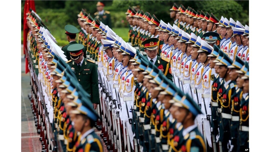 Members of the honor guard prepare for the arrival of France's President Francois Hollande at the Presidential Palace in Hanoi, Vietnam, Sept. 6, 2016.