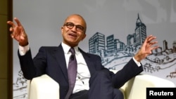 Microsoft Chief Executive Satya Nadella gestures as he speaks during a forum at Tsinghua University in Beijing, Sept. 25, 2014.