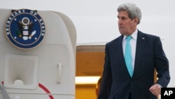 FILE - U.S. Secretary of State John Kerry disembarks from plane after arriving in Geneva, Switzerland, March 15, 2015.