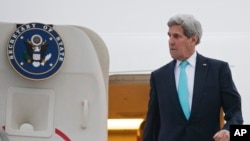 U.S. Secretary of State John Kerry disembarks from his plane as he arrives in Geneva, Switzerland, Sunday, March 15, 2015.