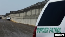 FILE - U.S. Border Patrol vehicles are patrol along the U.S. Mexico border area in San Diego, California, April 21, 2017. 