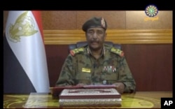 FILE - Image from video provided by Sudan TV, shows Lieutenant General Abdel Fattah Burhan, head of the Sudanese Transitional Military Council, TMC, making an announcement, in Khartoum, Sudan, June 4, 2019.
