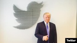 FILE - Donald Trump, during his 2016 presidential campaign, gets ready for a question-and-answer session on Twitter. The president issued a series of tweets Friday related to investigations into possible links between his campaign and Russia.