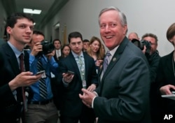 House Freedom Caucus Chairman Rep. Mark Meadows, R-N.C. smiles as he speaks with the media on Capitol Hill in Washington, March 23, 2017.