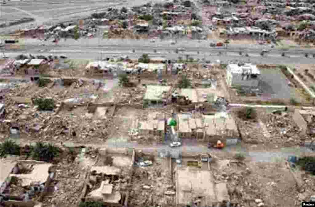 Damaged houses are seen in the earthquake stricken town of Bushehr in Iran. A powerful earthquake struck close to the country&#39;s only nuclear power station, killing more than 30 people and injuring more than 800 as it devastated small villages, state media reported.