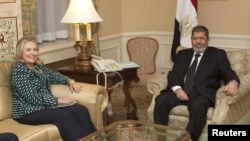 U.S. Secretary of State Hillary Clinton meets with Egyptian President Mohamed Morsi on the sidelines of the United Nations General Assembly in New York, September 24, 2012. 