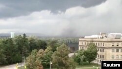 A tornado in Gatineau, Quebec, after a storm, is seen from Ottawa, Ontario, Sept. 21, 2018, in this still image taken from a social media video.