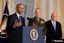 U.S. President Barack Obama delivers a statement accompanied by Director of National Intelligence James Clapper, right, and Chairman of the Joint Chiefs of Staff General Joseph Dunford after a meeting with Obama's national security team at the Treasury Department in Washington, U.S., June 14, 2016.