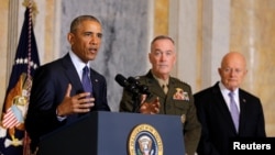 U.S. President Barack Obama delivers a statement accompanied by Director of National Intelligence James Clapper, right, and Chairman of the Joint Chiefs of Staff General Joseph Dunford after a meeting with Obama's national security team at the Treasury Department in Washington, U.S., June 14, 2016. 