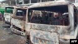 FILE - Burned buses are seen at the bus terminal in Buea, Cameroon, July 10, 2018. Gunfire broke out on July 9 in Buea, the capital of a western region of Cameroon gripped by violence between anglophone separatists and security forces.