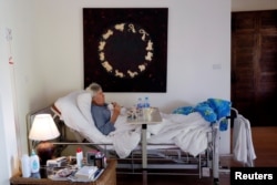 Charles, a retiree from England has breakfast in bed, while staying at the Care Resort in Chiang Mai, Thailand April 6, 2018. Picture taken April 6, 2018.