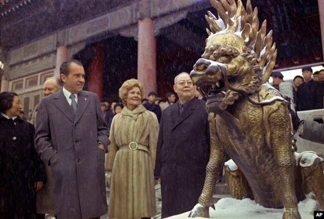 FILE - In this Feb 24, 1972 file photo, U.S. President Richard M. Nixon and first lady Pat Nixon are seen as they visit the tombs of Chinese emperors of the Ming Dynasty, in the suburbs of China's capital of Beijing. (AP Photo)