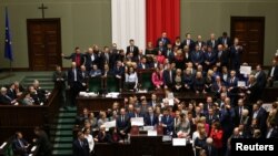 Polish opposition parliamentarians protest against the rules proposed by the head office of the lower house of parliament that would ban all recording of parliamentary sessions except by five selected television stations.