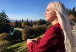 In this October 28, 2019, photo, Ashtyn Aure poses for a photo in Portland, Oregon. When Aure visited a clinic at Utah Valley University last year, she felt like she was having a breakdown.