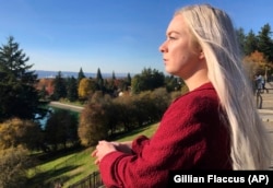In this October 28, 2019, photo, Ashtyn Aure poses for a photo in Portland, Oregon. When Aure visited a clinic at Utah Valley University last year, she felt like she was having a breakdown.
