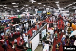 Visitors attend the 2015 Trade Show at the South by Southwest (SXSW) interactive, film and music conference in Austin, Texas, March 15, 2015.