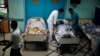 Patients lie in their beds on the ground floor of al-Wafa rehabilitation hospital after being evacuated from the fourth floor, which police said was hit by a tank shell fired by Israeli troops, in Gaza City, July 16, 2014.