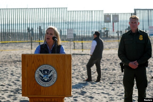 FILE - U.S. Secretary of Homeland Security Kirstjen Nielsen speaks next to the U.S. Mexico border at Border Field State Park in San Diego, California, Nov. 20, 2018.