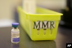 FILE- A measles vaccine is shown at a clinic in Greenbrae, Calif. South Sudan health ministry officials said a botched measles vaccination program left 15 young children dead.