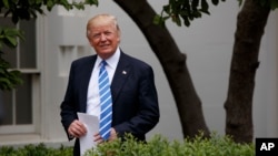 President Donald Trump arrives in the Kennedy Garden of the White House in Washington, May 1, 2017, to speak to the Independent Community Bankers Association. 