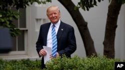 President Donald Trump arrives in the Kennedy Garden of the White House in Washington, May 1, 2017, to speak to the Independent Community Bankers Association. 