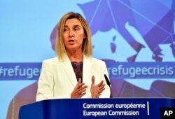 EU High Representative For Foreign Affairs and Security Policy Federica Mogherini, talks to the media prior an emergency EU heads of state summit on migration at the EU Commission headquarters in Brussels, Sept. 23, 2015.