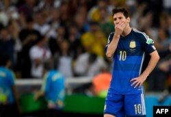 Argentina's forward and captain Lionel Messi reacts after losing the 2014 FIFA World Cup final football match between Germany and Argentina 1-0 following extra-time at the Maracana Stadium in Rio de Janeiro, Brazil, on July 13, 2014.