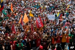 University students walk to a meeting point for a march against the government of President Nicolas Maduro, in Caracas, Venezuela, March 9, 2019.