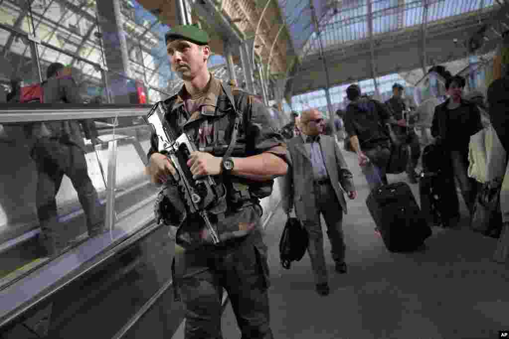 A soldier patrols at the Gare de Lyon train station in Paris, Sept. 26, 2014.