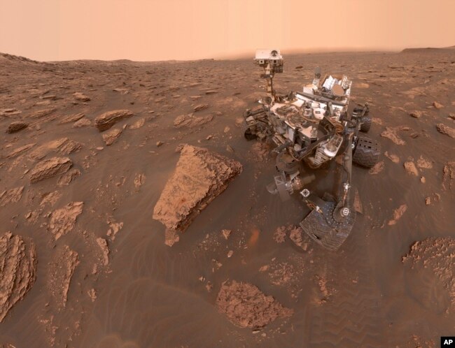 This composite image made from a series of June 15, 2018 photos shows a self-portrait of NASA's Curiosity Mars rover in the Gale Crater. (NASA/JPL-Caltech via AP)