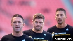 L.A. Galaxy’s Robbie Keane, left, L.A. Galaxy’s Steven Gerrard (8) and L.A. Galaxy’s Omar Gonzalez (4) warm up before an MLS soccer match against Real Salt Lake.