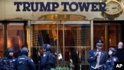 FILE - Members of the New York Police Department's counterterrorism unit guard Trump Tower, in New York City, Nov. 14, 2016. President Trump has alleged that his offices in the building were wiretapped last year on order of President Barack Obama.