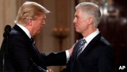 President Donald Trump shakes hands with 10th U.S. Circuit Court of Appeals Judge Neil Gorsuch, his choice for Supreme Court associate justice in the East Room of the White House in Washington, Jan. 31, 2017.