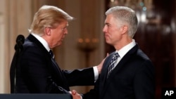 President Donald Trump shakes hands with 10th U.S. Circuit Court of Appeals Judge Neil Gorsuch, his choice for Supreme Court associate justice in the East Room of the White House in Washington, Jan. 31, 2017. 