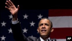 President Barack Obama speaks during a campaign fundraising concert in Miami Beach, Florida, June 26, 2012.