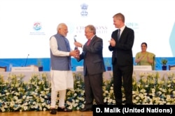 Prime Minister of India Narendra Modi receives the U.N. Champions of the Earth Award from U.N. Secretary-General António Guterres along with UNEP Chief Erik Solheim, right. The award ceremony was at the Pravasi Bharatiya Kendra in New Delhi, Oct. 3, 2018.