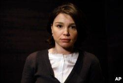 FILE - Zhanna Nemtsova, the daughter of Russian opposition figure Boris Nemtsov, is shown during an interview with The Associated Press in London, Feb. 25, 2016.