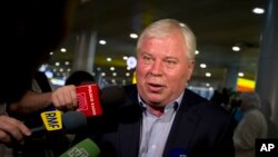 Lawyer Anatoly Kucherena speaks to reporters at Sheremetyevo airport outside Moscow, July 12. 2013.