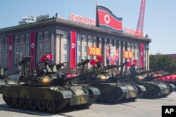 North Korean tanks roll past during a parade for the 70th anniversary of North Korea's founding day in Pyongyang, North Korea, Sept. 9, 2018.