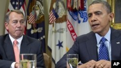 President Barack Obama, accompanied by House Speaker John Boehner of Ohio, speaks to reporters in the Roosevelt Room of the White House in Washington, November 16, 2012.