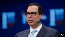 In this April 30, 2018 photo, Treasury Secretary Steven Mnuchin speaks during a discussion at the Milken Institute Global Conference, in Beverly Hills, Calif. 