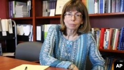 Margaret Stock, an Alaska-based immigration attorney and a retired Army Reserve lieutenant colonel who helped create the immigrant recruitment program, poses at her office in Anchorage, Alaska, July 3, 2018. Stock said she's been inundated over the past s