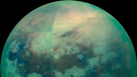 This Nov. 13, 2015 composite image made available by NASA shows an infrared view of Saturn's moon, Titan, as seen by the Cassini spacecraft. The near-infrared wavelengths in this image allow the cameras to penetrate the haze and reveal the moon's surface.