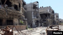 Cảnh tàn phá tại một khu vực trong thành phố Homs của Syria