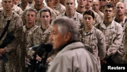 FILE - U.S. troops listen to U.S. Defense Secretary Chuck Hagel at Camp Bastion, Helmand Province, December 8, 2013. 