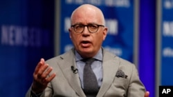 FILE - Author Michael Wolff is pictured at the Newseum in Washington, April 12, 2017, as he moderates a conversation with presidential counselor Kellyanne Conway during a forum titled "The President and the Press: The First Amendment in the First 100 Days." 
