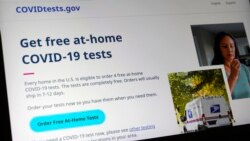 A U.S. government website is displayed on a computer, Jan. 19, 2022, in Walpole, Mass., that features a page where people can order free, at-home COVID-19 tests.