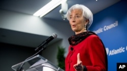 FILE - International Monetary Fund Managing Director Christine Lagarde speaks at the Atlantic Council, Washington, April 9, 2015.